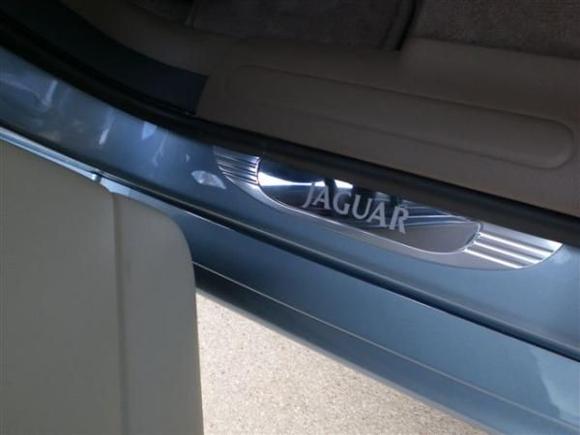 Added rear chrome door sill guards