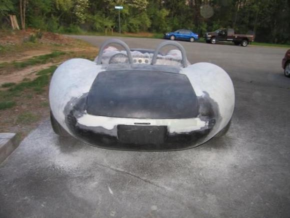 After lots and lots and lots and lots and lots and lots of sandingmore bondo and lots more sanding, it started to look like a Listera REALLY wide Lister that is (it is about 4 inches wider than a late model Corvette Z06!!).
