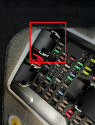 The black cover needs to pivot up to the right.