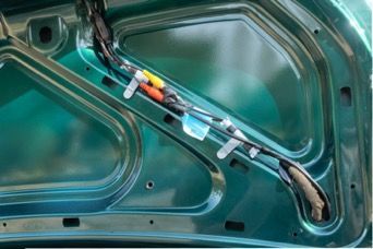 Video camera wires fastened to existing wires