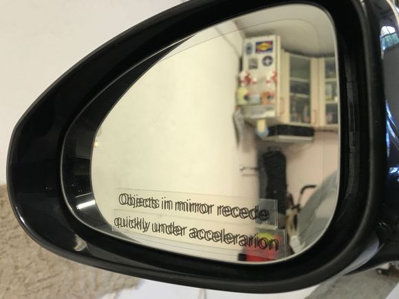 Objects in mirror recede quickly under acceleration