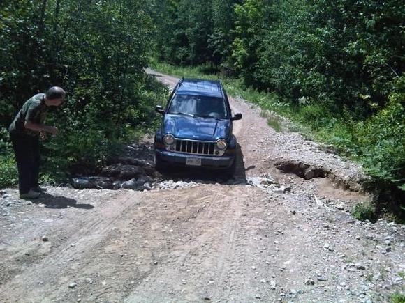 Errosion can be so much fun! Even when you are not sure the front bumber can make it. It did; but I forgot about the tow hitch still set up in back. Note to self: remove tow hitch (stow in the jeep though) before off-roading. E109 snowmobile trail is great but not what you expect without the snow.