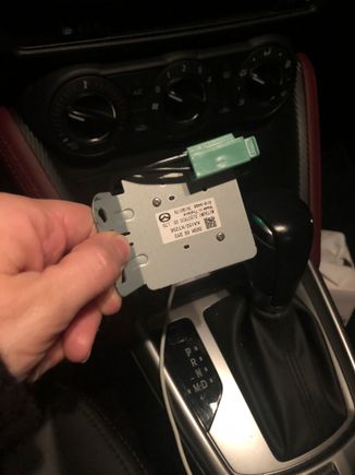 This fell out from under my steering wheel. I recently had my consol screen replaced and i googled the part number... says antenna enhancer... where does it go?  Can i do it myself?  Is it safe if i drive it for a couple days without it?  Thanks for the info.  