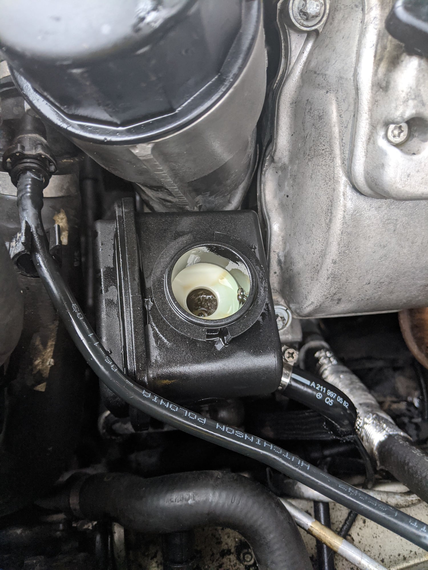 FAULTY steering pump causes hydraulic oil to leak out of the reservoir cap  