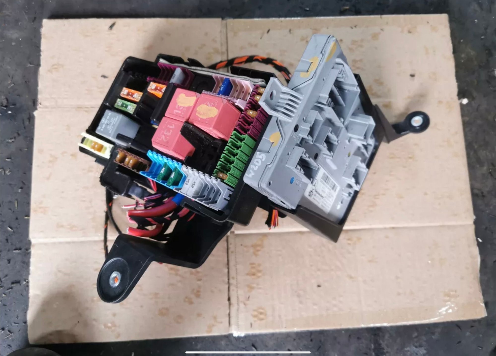 Found next to the fuse box in trunk