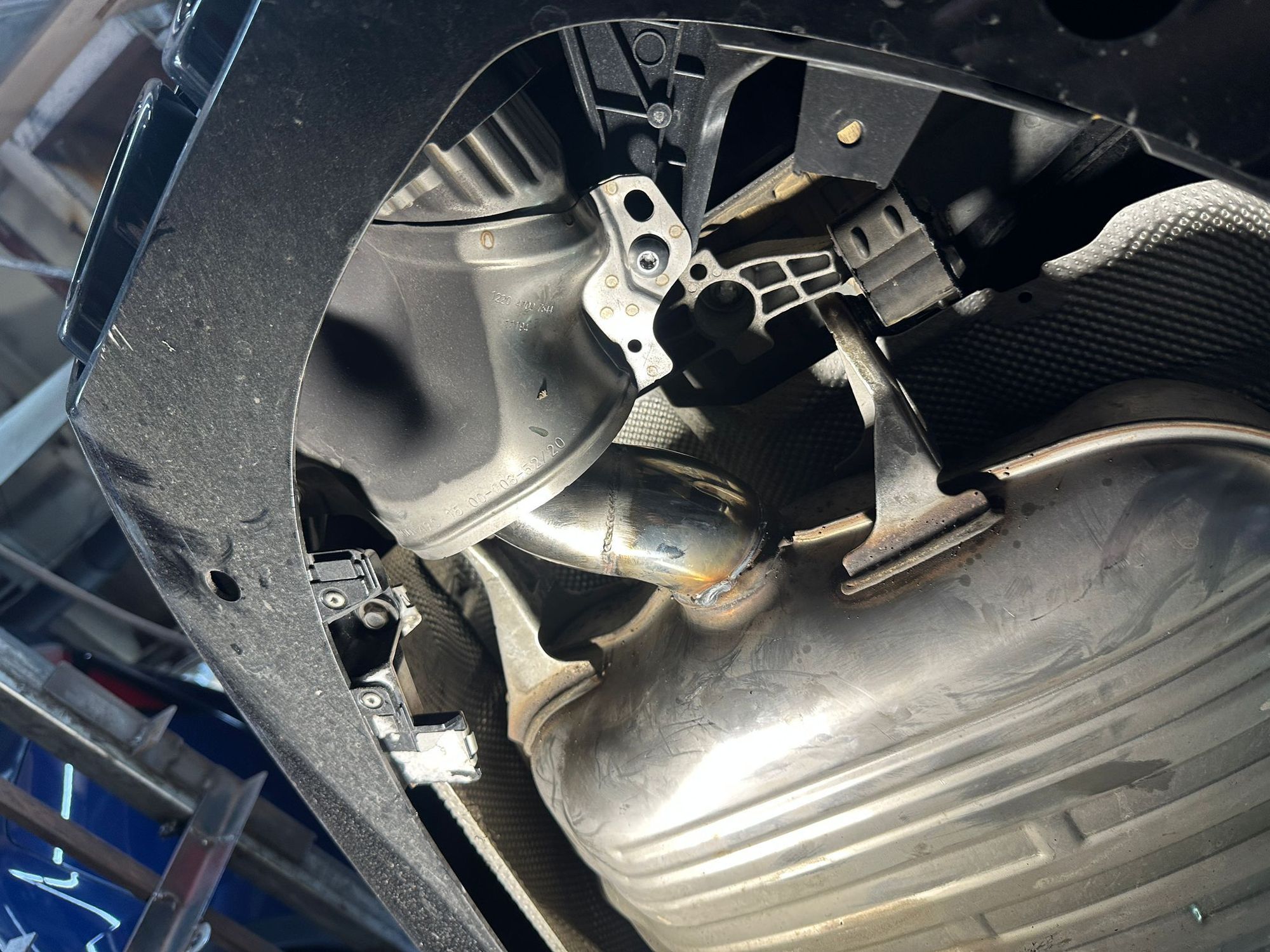 custom-welded a short extension pipe to redirect the flow backward