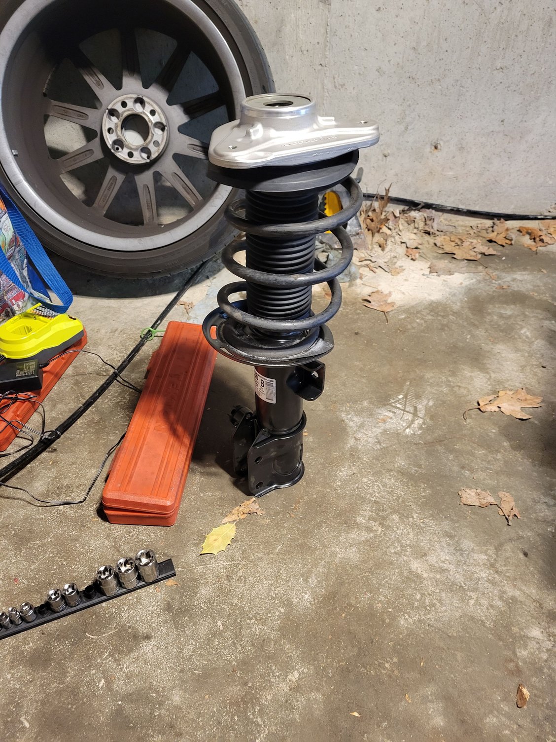 We initially reassembled wrong.  The upper spring was not properly seated in the cushion that inserts into the bearing.  So we had to recompress the spring and adjust it.