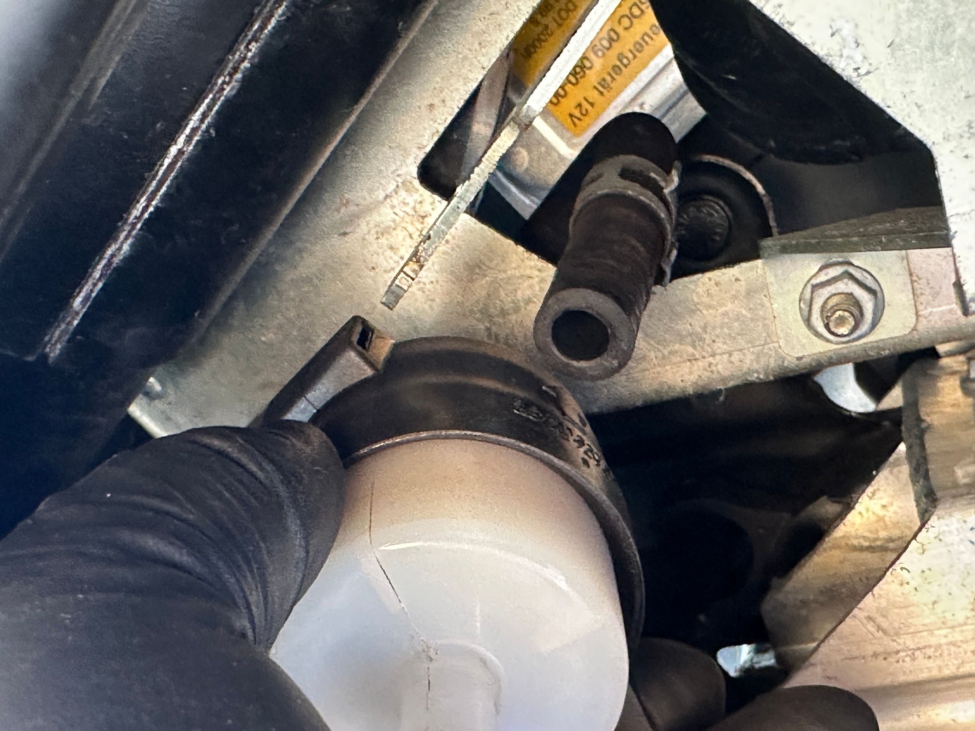 Hose removed from the upper nipple of the Airmatic air filter.
