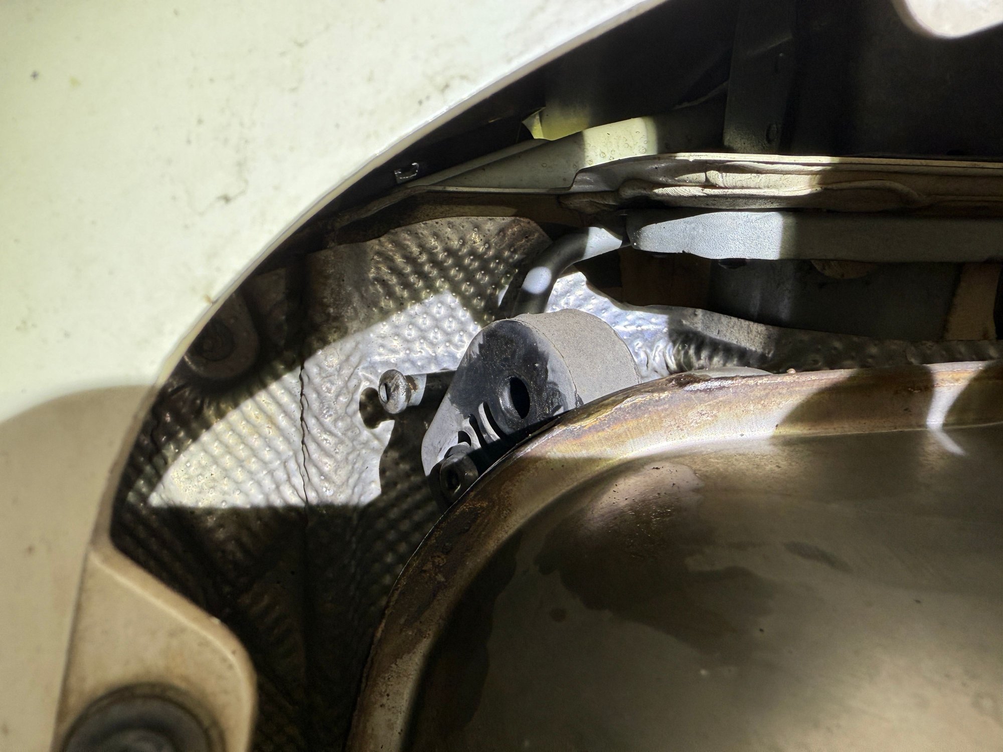 Really tight clearances to try and reach some of the exhaust hanger rubber holders to lower the exhaust out of the way to install the tow hitch. 