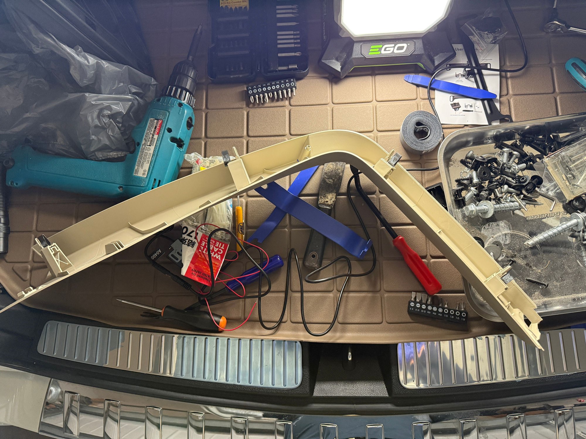 Passenger side rear glass frame plastic that has to be removed in order to run the rear dashcam wiring to the rear. 