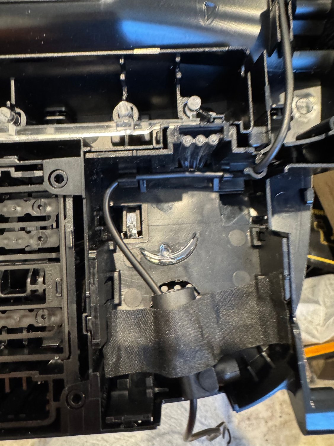 You can tape the mic casing in the empty space towards the rear.  I did drill a big hole originally trying to see the if the entire mic would fit in there - it wouldn�t.  But then I discovered there is actually a pre-allocated path to put the mic towards the front.  Just need to pry the front of the after mic apart with your nail.