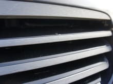 Some small bubbling chrome behind wrapped grill