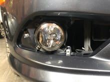 I removed the cover and cleaned the fog light.