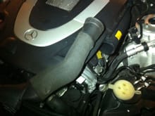 Inside the engine bay, disconnect the right air intake from the air filter housing and set aside.