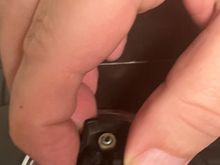 With the badge removed it is easy to compress the latch. 