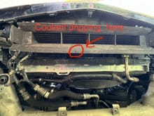 Top of photo is front of car from underneath. Circled area is the slow drip and unsure where it might be coming from. Hoses look good from the bottom and the top.