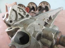 This closeup of the oil pump housing shows the mounting bracket that was snapped off by the force of the engine failure. 