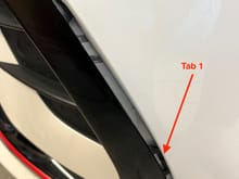 Don't completely disengage 1st two tabs until all tabs are released to avoid breaking non-locking tab on lower edge of trim.