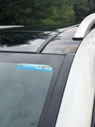 Plastic panel on driver side roof next to panorama roof showing slight peel.