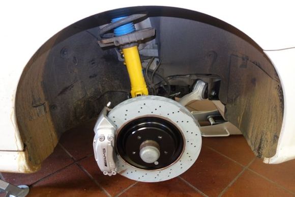 New front disc with painted center. Caliper paint is original - just needed cleaning.