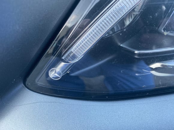 Closeup of inner headlight area.  Notice there's actually a small secondary piece the cut to fit in the area that would have otherwise lifted due to how sharp that curve is