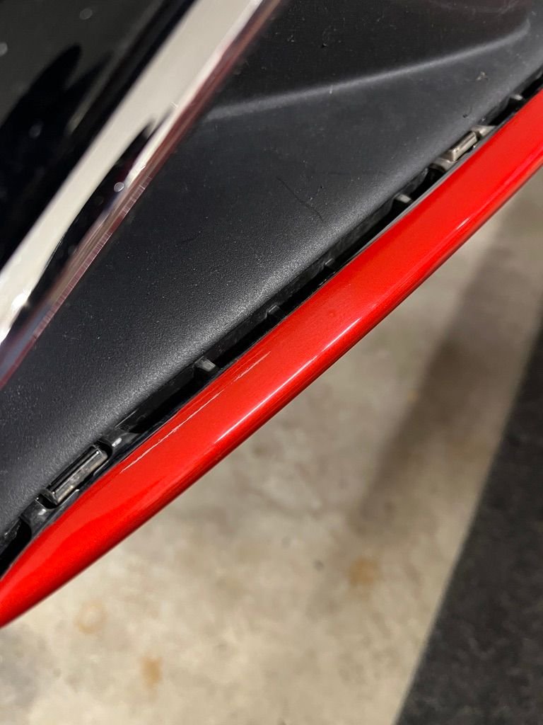 Removing front trim previously wrapped in red.
