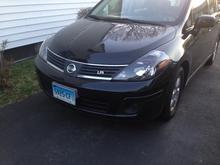 Nissan versa with black housing headlamp