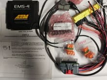 Included with the aem is a harness project, 2 bar map sensor and iat sensor.
