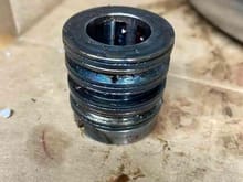 Metal bushing that goes over steering pinion.  Does in need to be re-added on a welded rack?