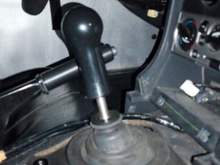 Comes with a aluminum finishing piece for the rubber boot, actually makes the no console look acceptable. AMS Evo Delrin Shift Knob, Delrin Ebrake Handle