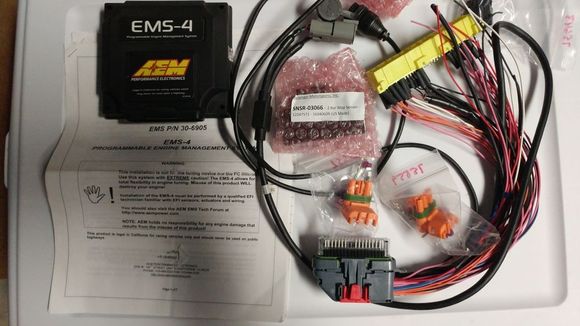 Included with the aem is a harness project, 2 bar map sensor and iat sensor.