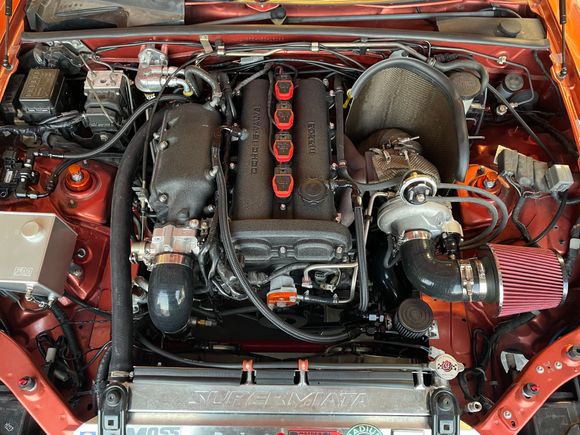 Another engine bay shot with the flex fuel sensor plumbed in.