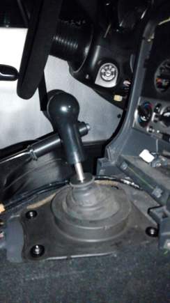 Comes with a aluminum finishing piece for the rubber boot, actually makes the no console look acceptable. AMS Evo Delrin Shift Knob, Delrin Ebrake Handle