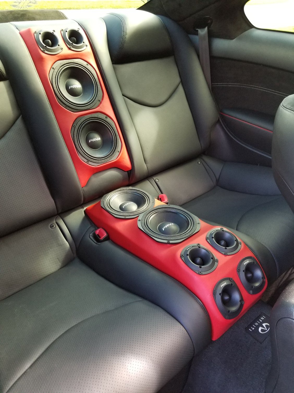 Has anyone seen this done? Subwoofer in rearseat (picture example