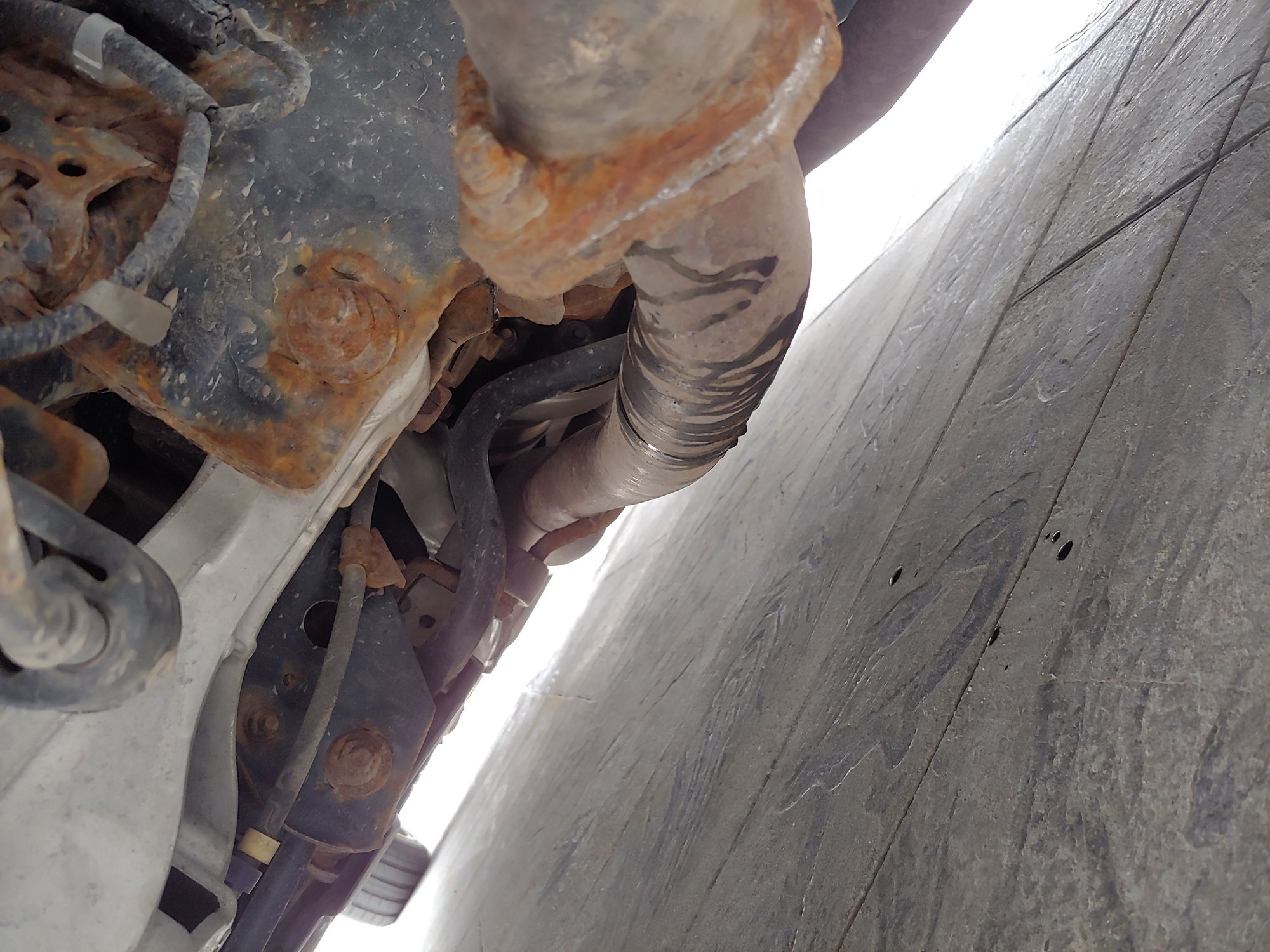 G37 leaking black oil onto exhaust pipes MyG37