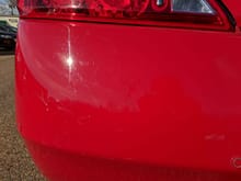 Small indent in rear bumper, was here before purchase.