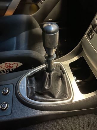 Leather boot was able to be re-used. You can really see the blue-slate in the "Titan" finish so I swapped to a black shift knob.