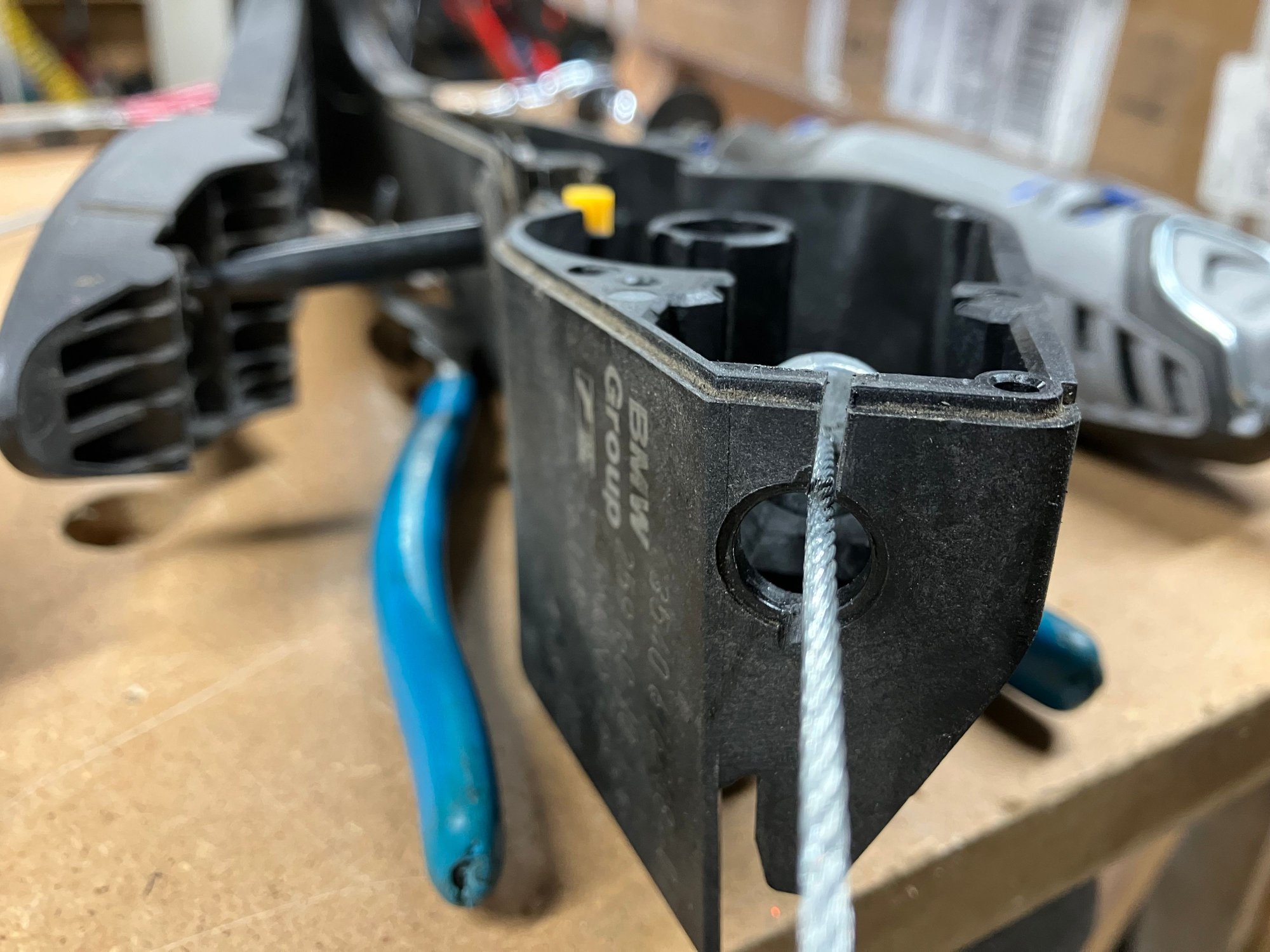 There should be a cap at the very top of the MINI pedal box. Just pop that out and cut a groove to slip the cable through.