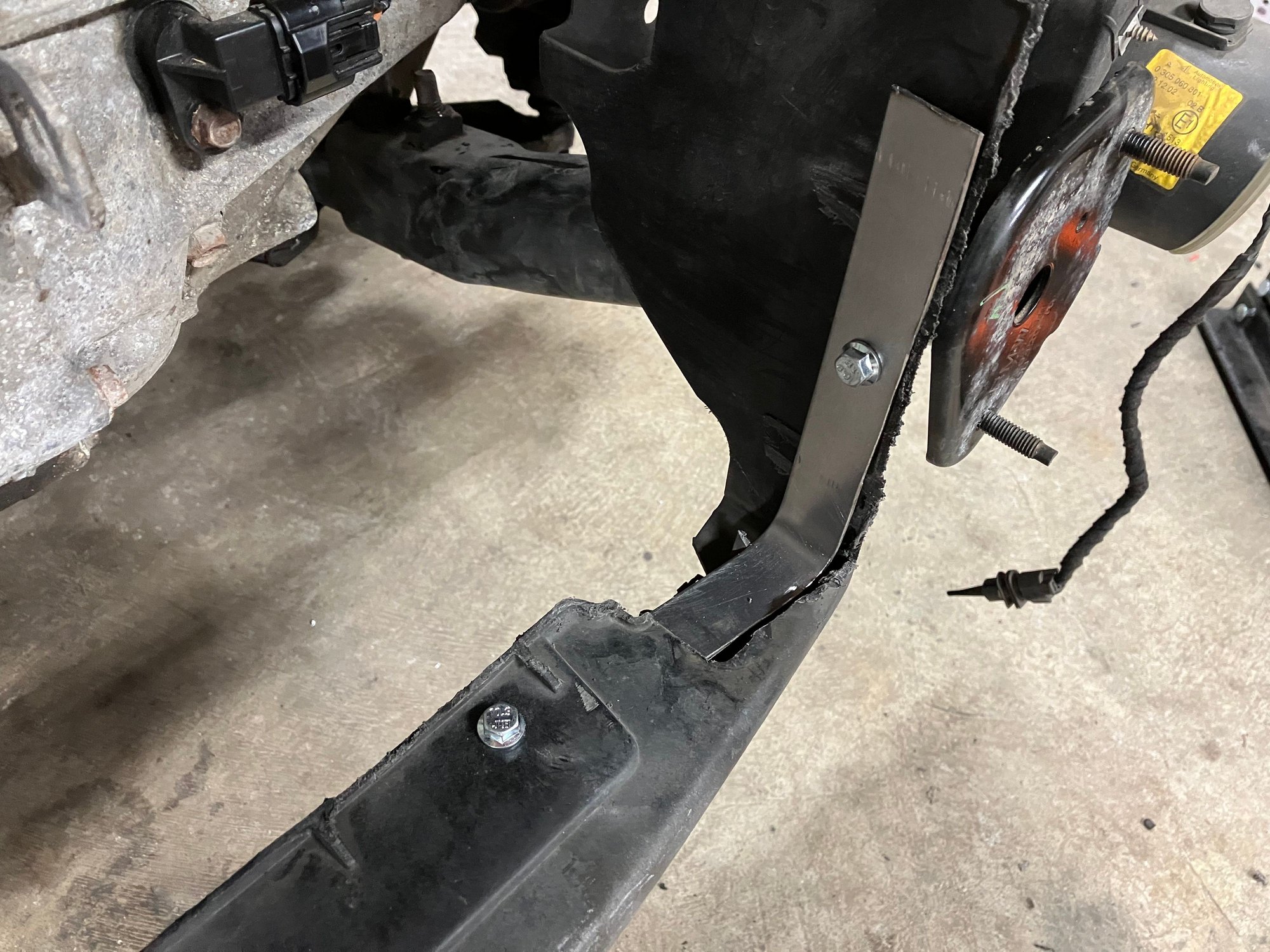 This is what I�ve come up with. Very basic and not exactly pretty but it doesn�t give enough rigidity to the rad support so I�m no longer worried about running over the radiator as it falls out the bottom of the car.