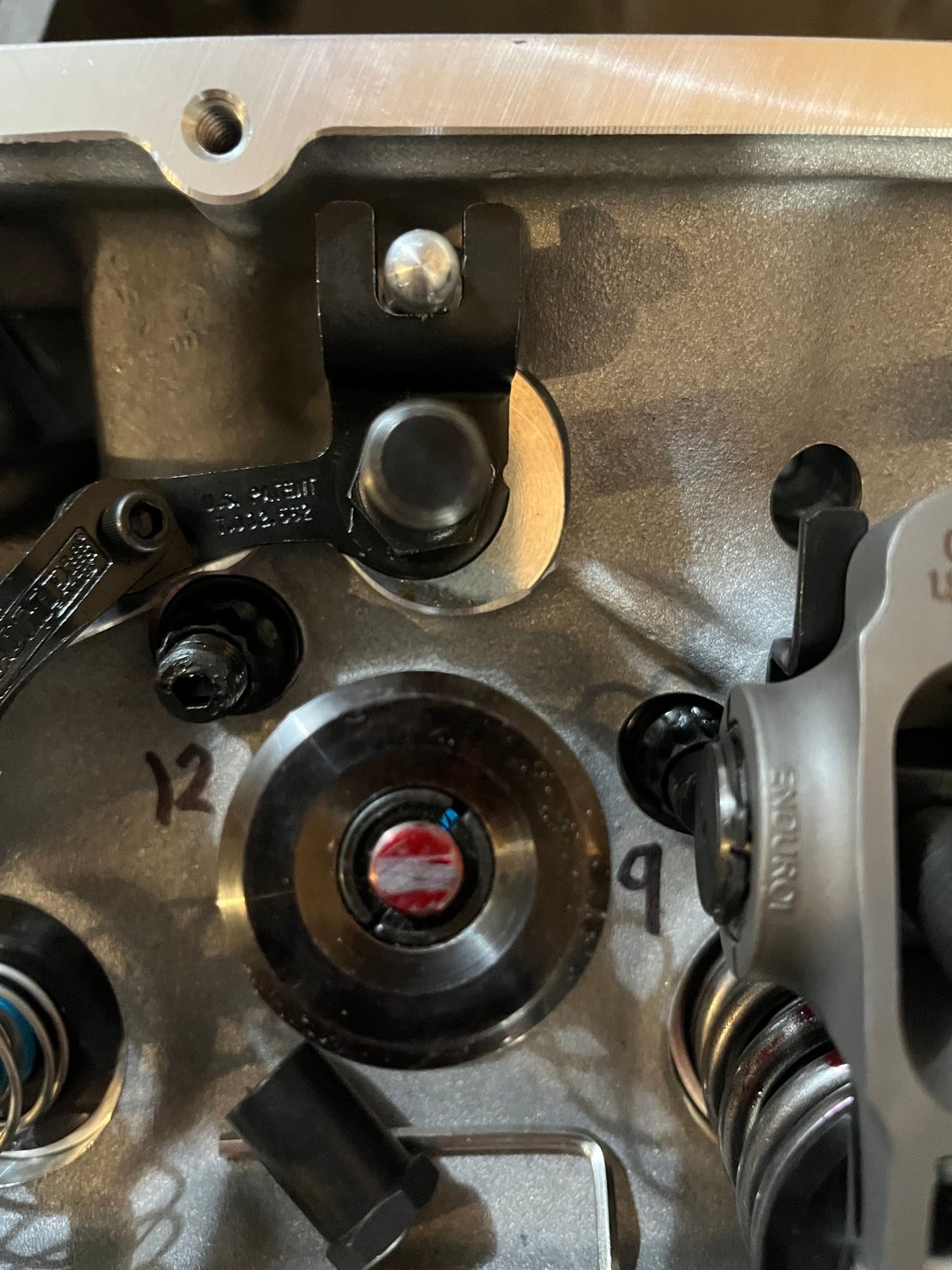 Intake valve shorter pushrod centered mark but wide.