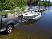 It's in a little too far but i wasn't sure how deep to be so the tracking fins didn't hit the trailer.  I'll have to relaunch and load again to get some measurements to make the bow stop and i know the bow stop will make a big difference as to how deep the trailer has to be because the boat floated /slid forward a bit once the stern started to float.