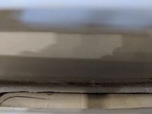 Opening under sun pad showing path to engine compartment.