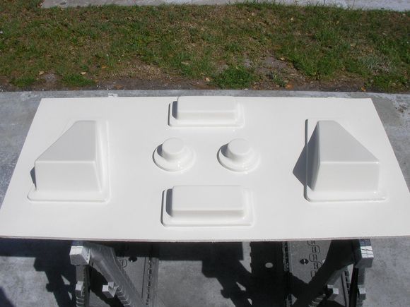 it'll get another coat w/ patch booster after about 4 hours. then after a few days the plan is to sand only the mold down (not the table) (mask the table) and shoot the rest of the orange tooling gel coat on it, approx 16 oz's