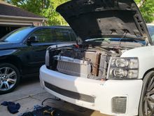 Mounted just behind lower bumper opening 