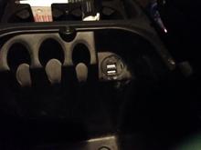 I don't like wires hanging out of my dash so I installed a double USB plug in my console.