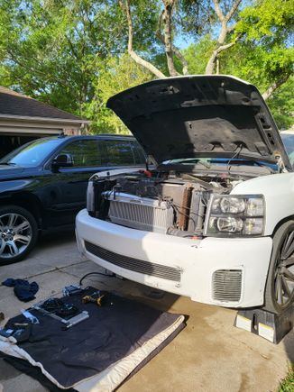 Mounted just behind lower bumper opening 