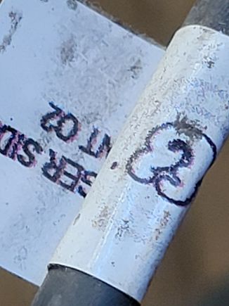 The harness has these circuit tags with, what I am assuming is, the brand name logo. You can see the symbol on the right of the label.