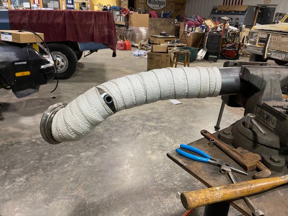 Asbestos wrap on down pipe.