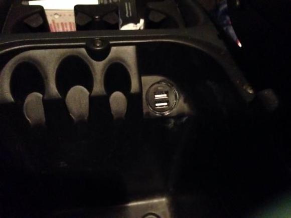 I don't like wires hanging out of my dash so I installed a double USB plug in my console.