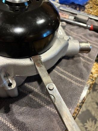 i used a feeler gauge to measure the distance of the pulley to the pump.  I used a sharpie to make a line on either side of where the gauge was used.